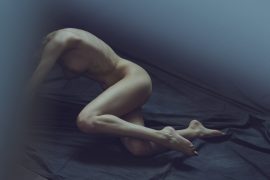 Thumbnail Naked girl lying on floor by Stefan Rappo