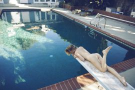 Thumbnail Naked girl lying by swimming pool by Stefan Rappo