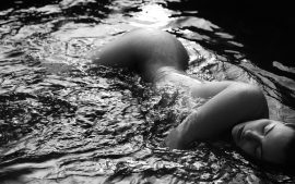 Thumbnail Naked girl merging in water by Stefan Rappo