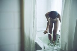 Thumbnail Naked black girl filling up bathtub by Stefan Rappo