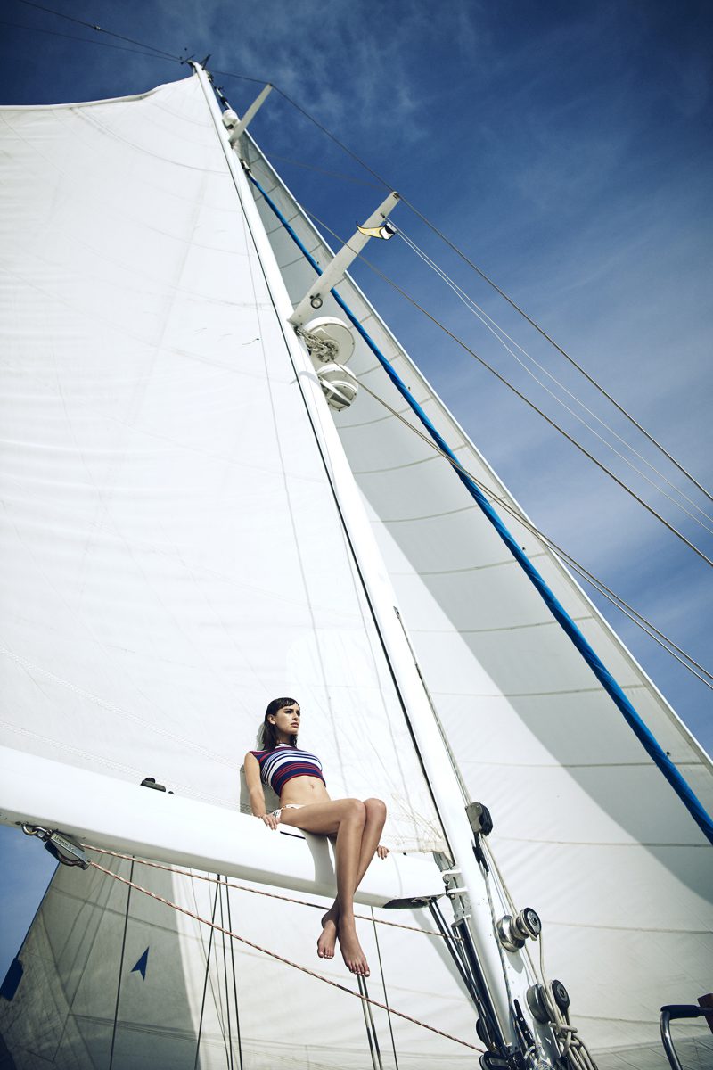 girl sitting on boat by stefan rappo