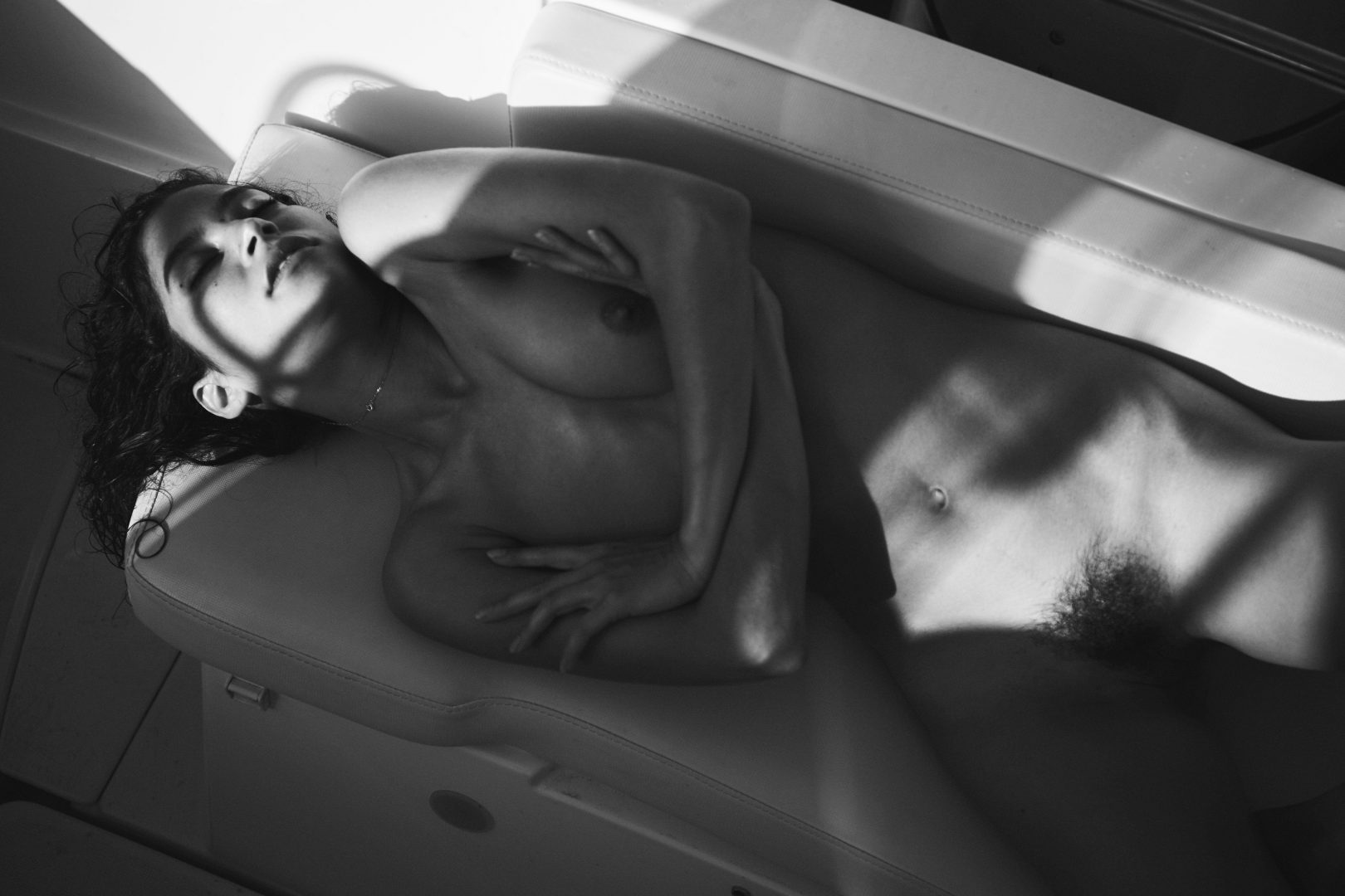 Naked woman on boat by stefan rappo