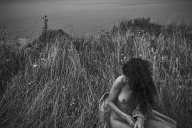Thumbnail naked girl on cliff by stefan rappo