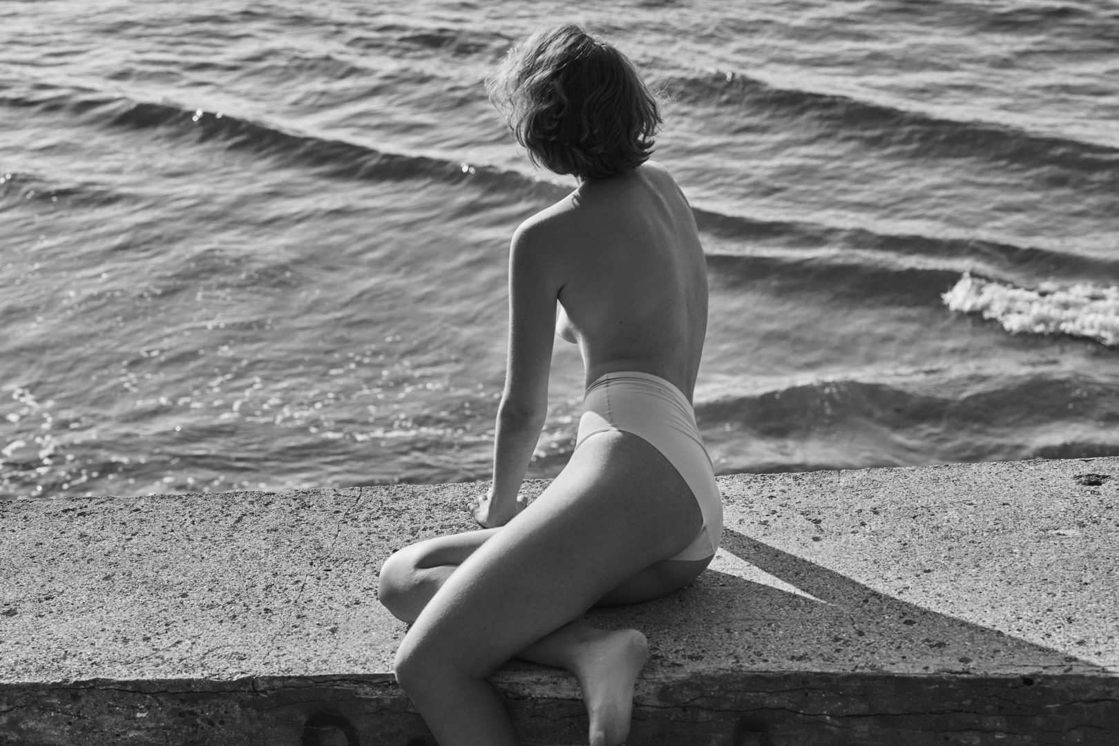 woman at the beach by Stefan Rappo