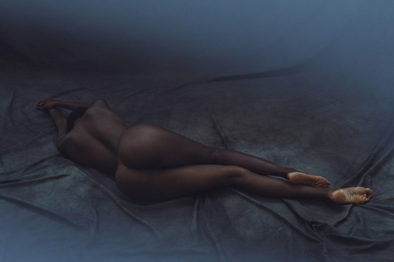Naked girl lying on floor by Stefan Rappo