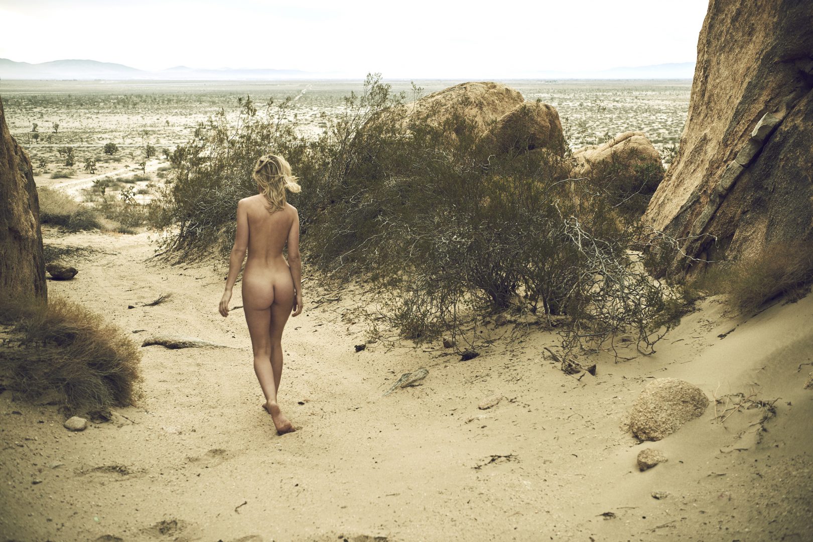 Naked girl walking in desert by Stefan Rappo