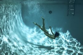 Thumbnail Naked girl diving in swimming pool by Stefan Rappo