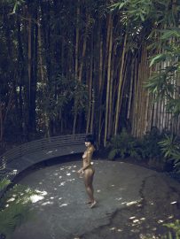 Thumbnail Naked girl in front of bamboo trees by Stefan Rappo