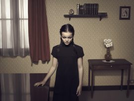 Thumbnail Girl standing at table in middle of room 42 by Stefan Rappo