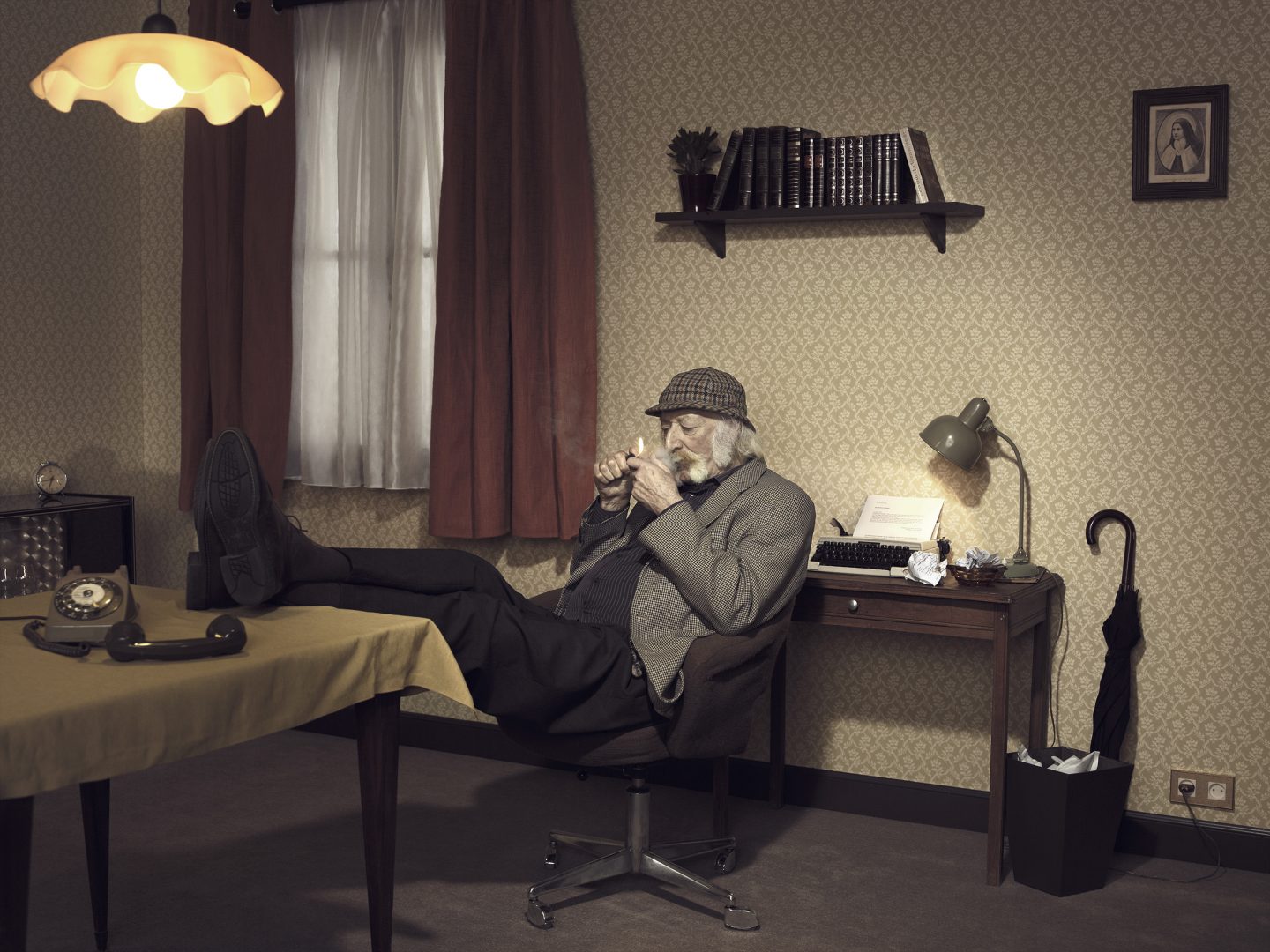 Old man with Sherlock Holmes lock lights pipe in room 42 by Stefan Rappo