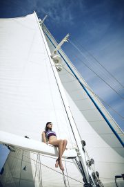 Thumbnail girl sitting on boat by stefan rappo