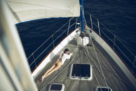 Thumbnail girl lying on boat by stefan rappo