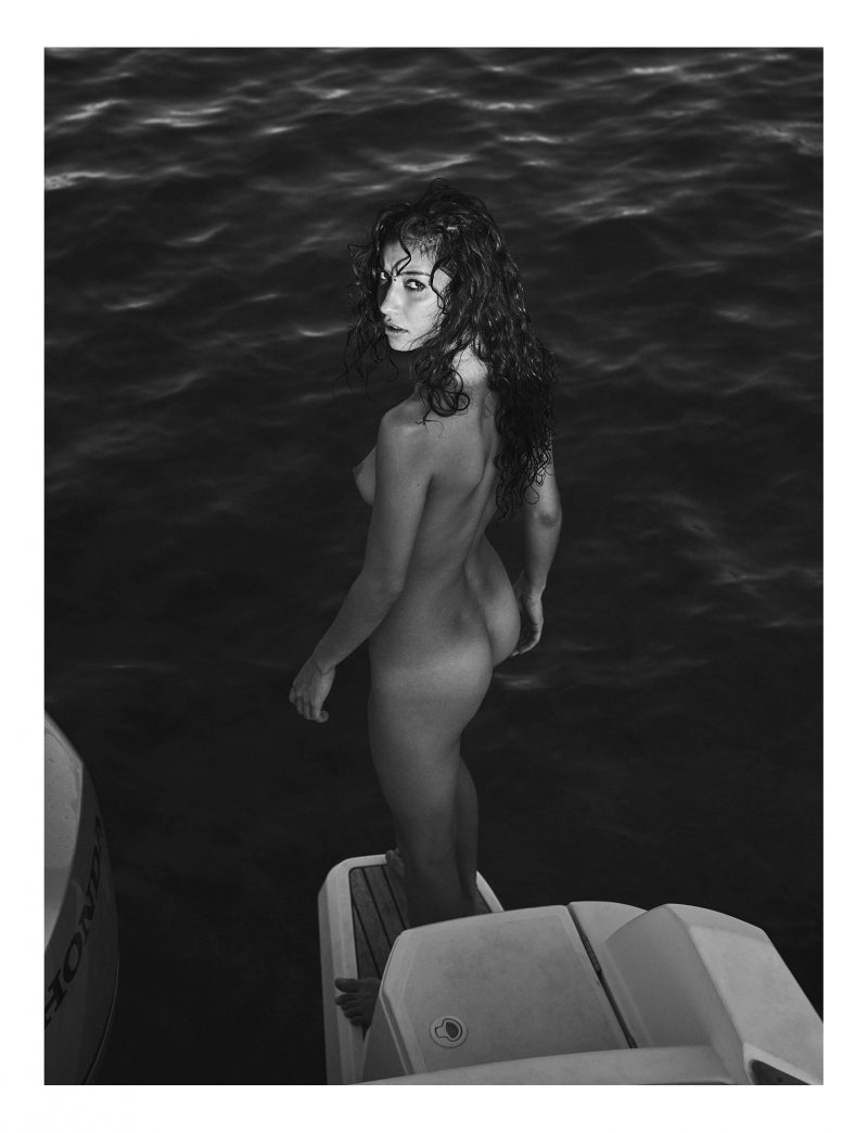 Naked woman on boat by stefan rappo