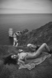 Thumbnail naked girl on cliff by stefan rappo